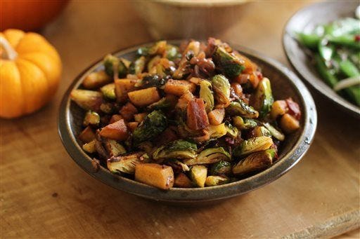 Brussels sprouts with bacon in Concord, N.H. This recipe allows for a crispy texture of the Brussels sprouts without frying. (AP Photo/Matthew Mead