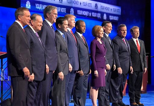 In this photo taken Oct. 28, 2015, Republican presidential candidates, from left, John Kasich, Mike Huckabee, Jeb Bush, Marco Rubio, Donald Trump, Ben Carson, Carly Fiorina, Ted Cruz, Chris Christie, and Rand Paul take the stage during the CNBC Republican presidential debate at the University of Colorado, in Boulder, Colo. Christie could be relegated off the main stage at next week's GOP presidential debate and Bobby Jindal and George Pataki risk being shut out altogether, as the trio become potential victims of their poor showings in preference polling and how those polls are being used. -AP Photo/Mark J. Terrill