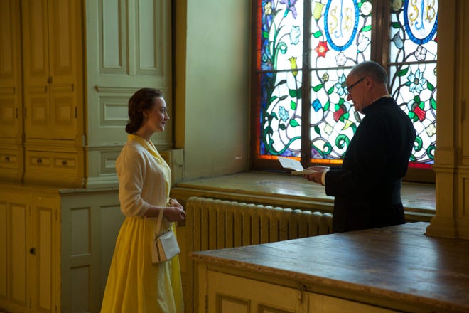 Eilis (Saoirse Ronan) gets some advice from Father Flood (Jim Broadbent) in “Brooklyn.”