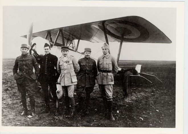 Original members of the Lafayette Escadrille in World War I, from left: James McConnell, Kiffin Rockwell, Captain Georges Thenault, Norman Prince, and Victor Chapman. All four American aviators would be killed within a few months of posing for this photograph, which is part of an exhibit at the Redwood Library & Athenaeum in Newport.