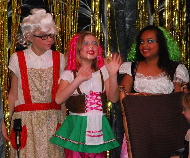(From left to right) Kylee Goble, Claire Fortier and Kaylie Hutterson pose during a performance of "Whatever Happened to the Big, Bad Wolf."