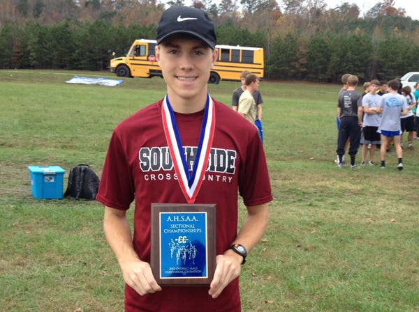 Southside's Hunter Nails poses with the plaque after winning the Class 6A, Section 5 boys high school cross-country championship on Thursday.