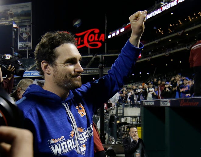 Mets' Daniel Murphy waves to fans at Citi Field after the team lost the World Series to the Kansas City Royals on Monday. Murphy, a free agent, isn't expected to accept the Mets' $15.8 million qualifying offer. The Associated Press