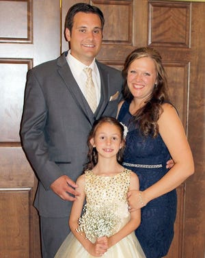Patrick and Emillie Peters of Jackson Township with their daughter, Rayannah. The Peters adopted Rayannah, 7, in 2014.