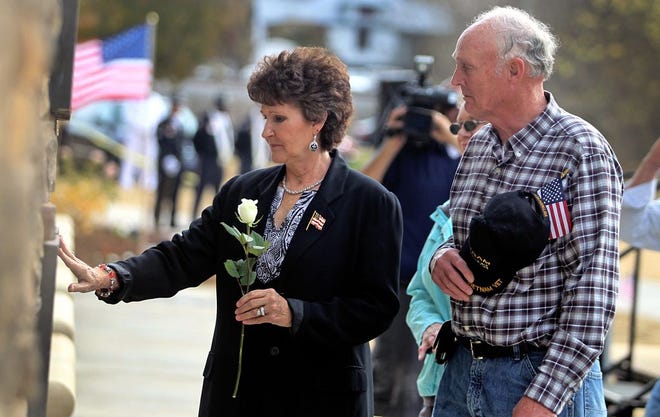 Wife Donna Anthony and brother Wayne Dellinger honor Sgt. Robert Larry Dellinger at the Kings Mountain Vietnam Veterans Memorial during a Veterans Day Observance in 2012. Sgt. Robert Larry Dellinger was killed in action on Oct. 27, 1968. (Star file photo)