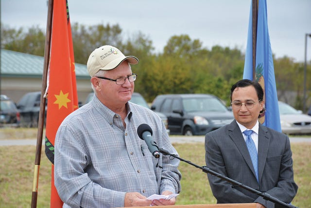 Tribal Councilor Dick Lay speaks to the crowd at the Oct. 27 groundbreaking for a new community building in Nowata as Secretary of State Chuck Hoskin Jr. looks on.