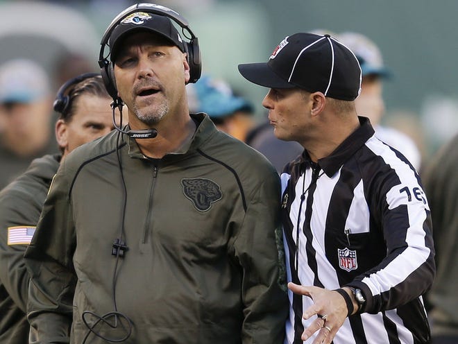 Umpire Darrell Jenkins talks with Jacksonville Jaguars head coach Gus Bradley during the third quarter of the Jaguars' loss to the Jets.