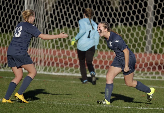 Hannah McNulty of Toll Gate, right, roars after scoring one of her three goals on Sunday afternoon.