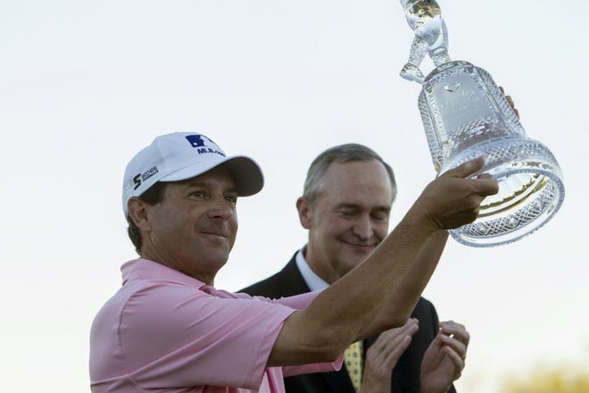 Billy Andrade holds his trophy after winning the Charles Schwab Cup Championship on Sunday in Scottsdale, Ariz.