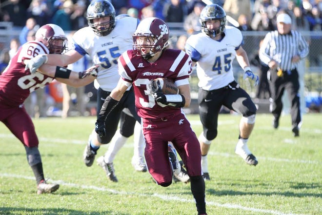 Alex Harrison, 38, totes the pigskin for Rockridge in the Saturday, Nov. 7 playoff game against top-ranked Tri-Valley.