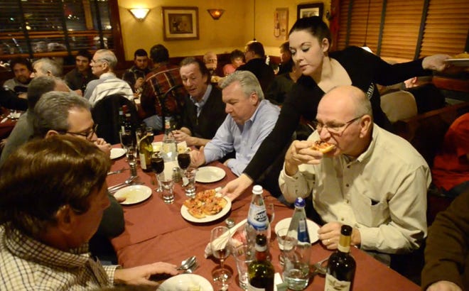 Diners fill the dining room as they enjoy some of Gino Lenti's Italian specialties during one of the special first Monday night of the month dinners earlier this year at La Villa Pizza & Restaurant in Morrisville. staff photo by Bill Fraser