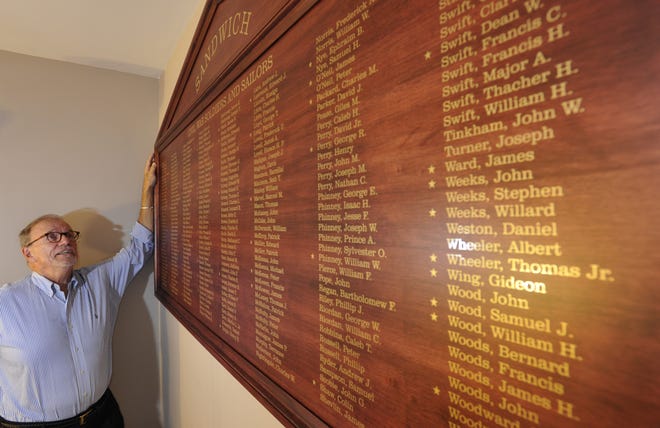 William Daley admires a new plaque bearing the 294 names of Sandwich's Civil War veterans. The plaque is mounted on the wall at Sandwich Town Hall and will be dedicated on Veterans Day. 

Steve Heaslip/Cape Cod Times