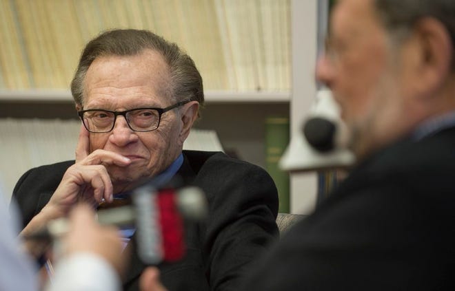 Radio and television personality Larry King listens as Charley Steiner is interviewed Monday at Bradley University. Long-time friends, King joined Steiner, a Bradley University alumnus, for the first Charley Steiner Sports Symposium on the campus.