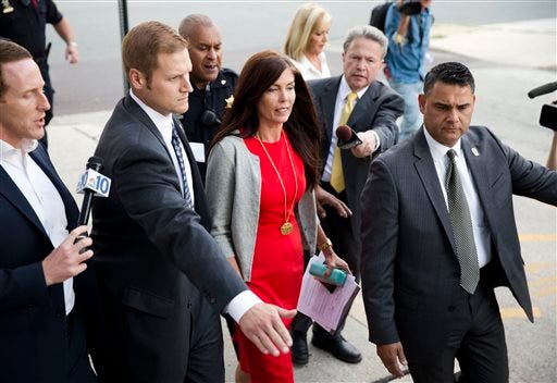 In this Aug. 24, 2015, file photo, Pennsylvania Attorney General Kathleen Kane departs after her preliminary hearing at the Montgomery County courthouse in Norristown, Pa. The Pennsylvania Supreme Court's temporary suspension of Kane's law license began Thursday, Oct. 22, 2015, and a day later, state senators outlined plans for a bipartisan committee to determine whether Kane should be removed from office. (AP Photo/Matt Rourke, File)