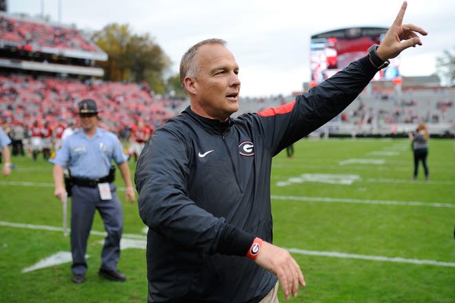 Georgia head coach Mark Richt celebrates with the fans during the second half of an NCAA college football game between Georgia and Kentucky on Saturday, Nov. 7, 2015, in Athens, Ga. (AJ Reynolds/Staff, @ajreynoldsphoto)