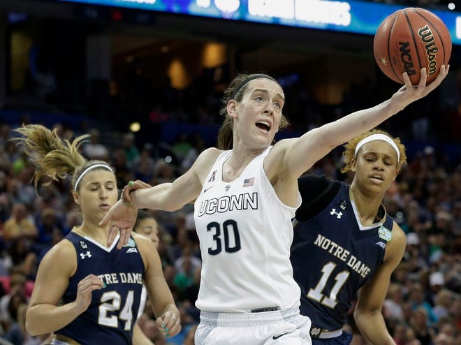 In this April 7, 2015, file photo, Connecticut forward Breanna Stewart (30) recovers a rebound as Notre Dame guard Hannah Huffman (24) and forward Brianna Turner (11) look on during the second half of the NCAA women's Final Four tournament college basketball championship game in Tampa, Fla. Stewart was selected to The Associated Press preseason All-America team, Tuesday, Nov. 10, 2015.