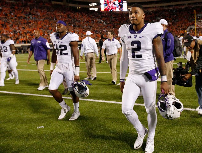TCU quarterback Trevone Boykin, left, walks off the field following a loss to Oklahoma State on Saturday in Stillwater, Okla. The No. 13-ranked Horned Frogs host Kansas this Saturday.