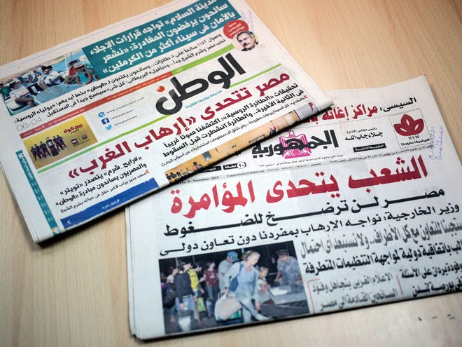 Two Egyptian daily newspapers from Sunday display headlines touting Western conspiracy theories in the plane crash of a Russian passenger jet last month over the Sinai peninsula. ÒThe people defy the conspiracy -- Egypt will not cave in to pressures,Ó the state-owned Al-Gomhuria newspaper, bottom, proclaimed in a front-page headline while the independent daily, El-Watan, top, headlined, ÒEgypt stands up to Ôthe WestÕs terrorism.Ó