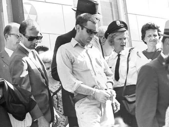 Lee Roy Martin, center, is led from the Cherokee County courthouse in 1968. Martin, called the “Gaffney Strangler,” was convicted of murdering four women and sentenced to life in prison. Martin was killed by another inmate in 1972.