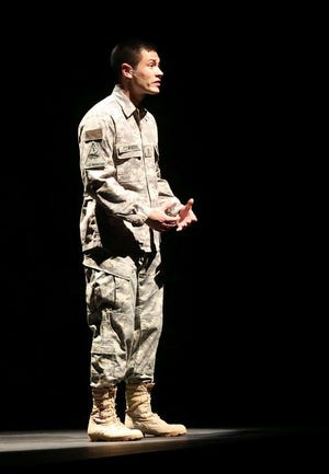 An actor portrays 2nd Lt. Leonard Cowherd reading a letter that he addressed to his loved ones back home. The Marina Civic Center hosted "Letters Home" on Nov. 10. (Patti Blake | The News Herald)