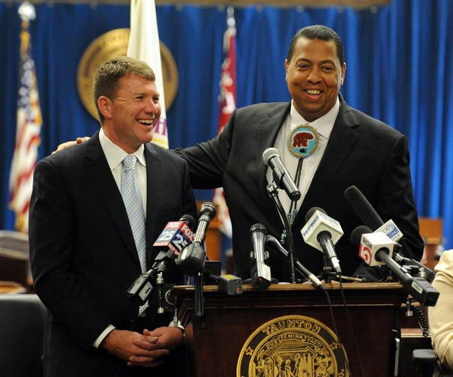 Taunton Mayor Thomas Hoye, left, and Mashpee Wampanoag Tribal Council chairman Cedric Cromwell share a laugh while speaking to the media in September about the First Light casino which will be built in Taunton. The tribe announced today that land in Mashpee and Taunton has been officially taken into trust.