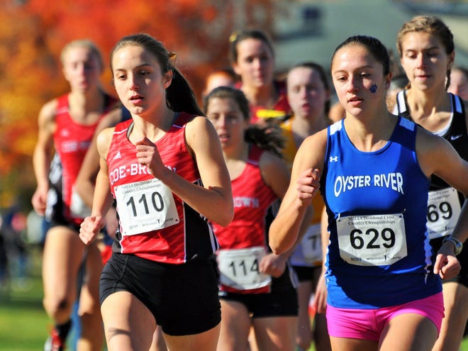 Coe-Brown's Elisabeth Danis, left, and Oyster River's Maegan Doody will be running in the New England championship Saturday in Thetford, Vt. Mike Whaley/Fosters.com