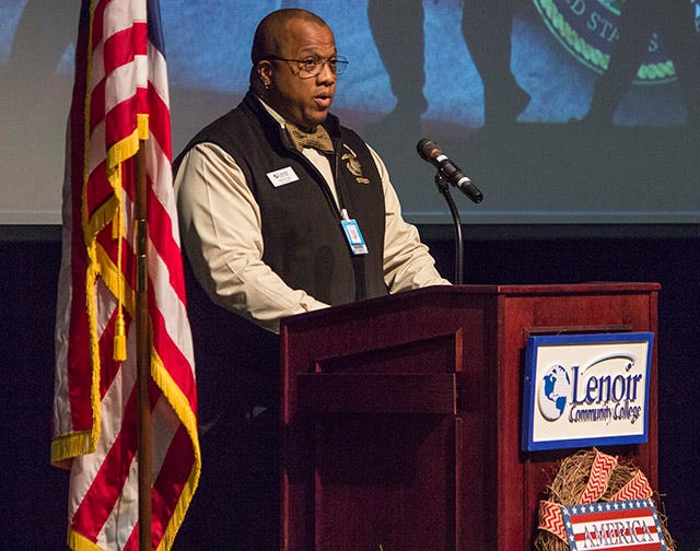 U.S. Marine Corps Veteran and SGA President Merrill Tufts lead the audience in the Pledge of Allegiance and introduced the two guest speakers to the stage on Wednesday during the Veterans' Day celebration at Lenoir Community College.