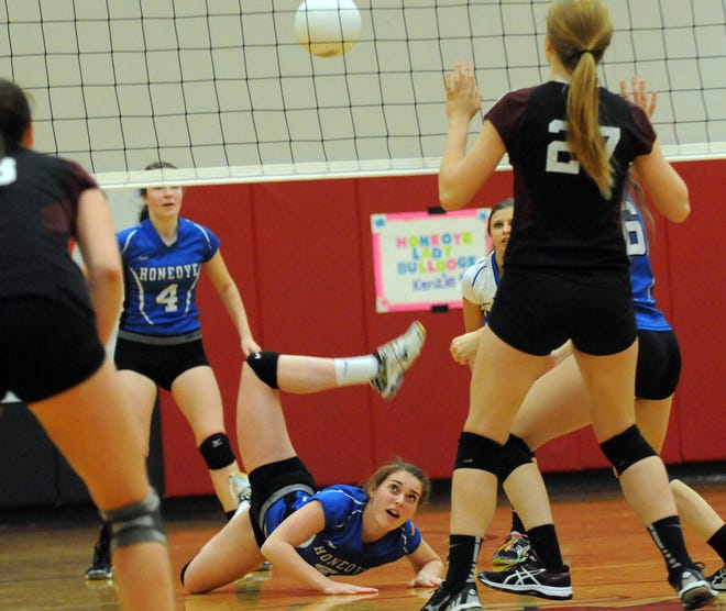 Jack Haley/Messenger Post Media

Honeoye's Hailey Cornish makes a diving save and the Bulldogs ended up winning the point during their match against the Bees.