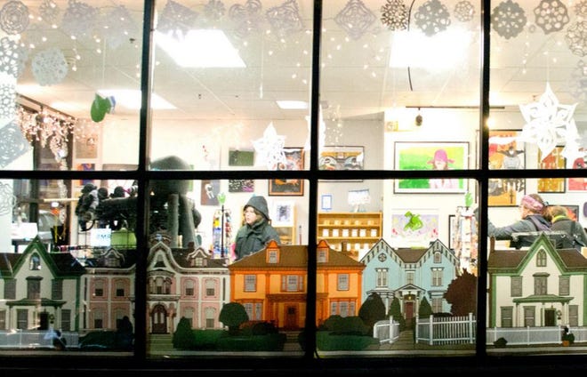 A downtown storefront window from the 2014 Deck The Windows contest. COURTESY OF AHA!