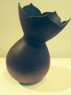 "Children's Trophy" by Rosanne Somerson is carved from mahogany. Somerson is one of the Smokestack Studios artists currently exhibiting at the Narrows Gallery.

DON WILKINSON