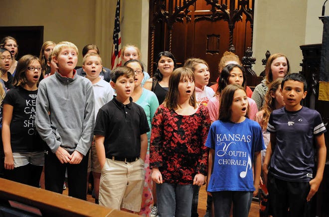 The Kansas Youth Chorale, a Topeka-based, by-audition choir of fourth- through eighth-graders, rehearses in the chancel of First Presbyterian Church for its "Sounds of the Season" concert that will be at 7 p.m. Sunday at Wanamaker Woods Church of the Nazarene, 3501 S.W. Wanamaker Road.
