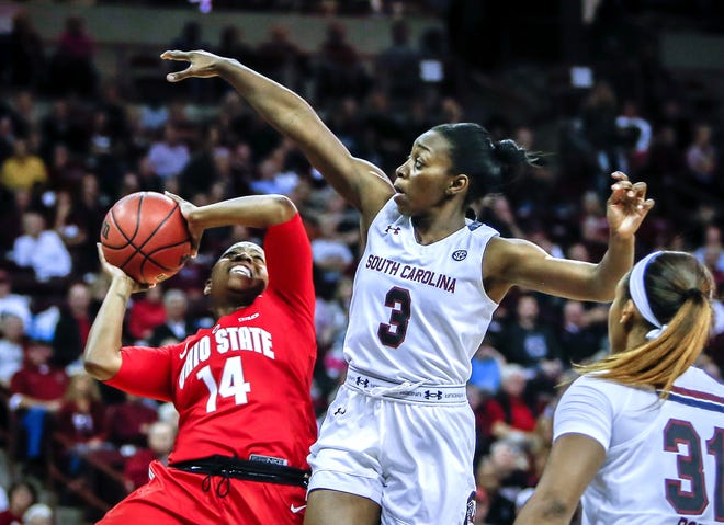 South Carolina guard Khadijah Sessions (5) defends Ohio State guard Ameryst Alston (14) during the first half of Friday's game in Columbia. STEPHEN B. MORTON/AP