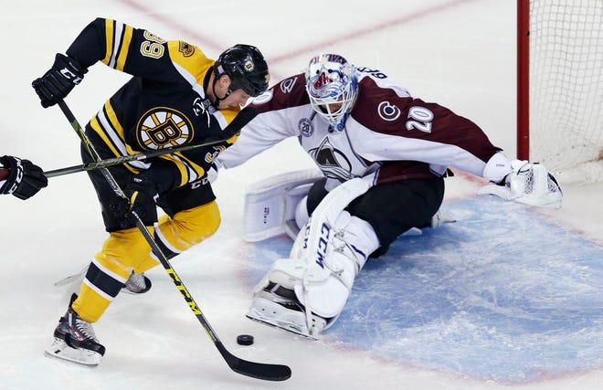 Colorado Avalanche goalie Reto Berra makes a kick save on a shot by Boston Bruins left wing Matt Beleskey during the first period of an NHL hockey game in Boston, Thursday, Nov. 12, 2015.