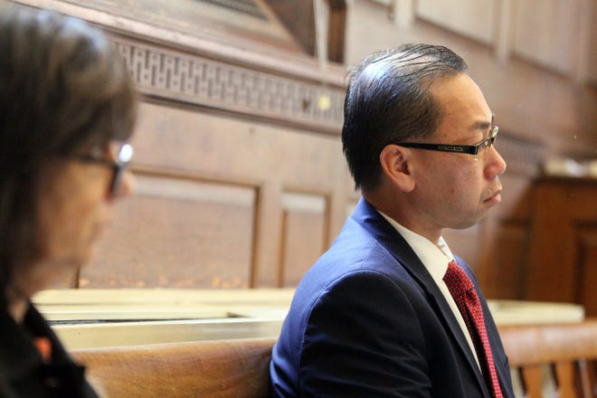 Cranston Mayor Allan Fung listens in the Superior Courtroom of Judge Sarah Taft-Carter as the trial begins in the lawsuit by Cranston police and fire retirees who refused to join compromise agreement. (Providence Journal photo / Mary Murphy)