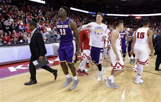 Western Illinois' Jalen Chapman (33) celebrate after Western Illinois defeated Wisconsin 68-67 in an NCAA college basketball game Friday, Nov. 13, 2015, in Madison, Wis. (AP Photo/Andy Manis)