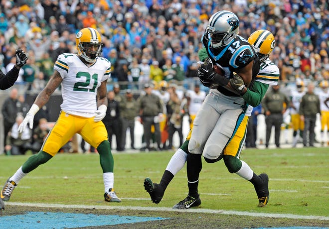 Carolina Panthers' Devin Funchess (17) runs into the end zone for a touchdown in front of Green Bay Packers' Damarious Randall (23) and Ha Ha Clinton-Dix (21) in the second half of an NFL football game in Charlotte, N.C., Sunday, Nov. 8, 2015. (AP Photo/Mike McCarn)