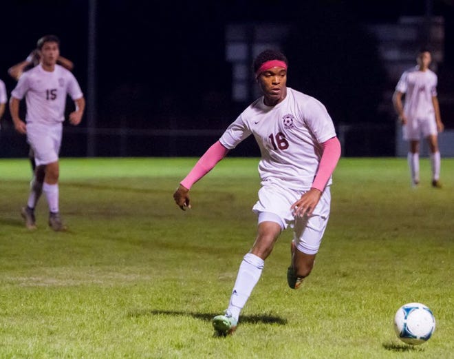 Dixon’s IJ Woodby runs toward the ball on Wednesday night during the Bulldogs’ 2-1 sudden-death overtime win over Croatan. The Bulldogs play host to Jordan-Matthews on Saturday in the NCHSAA 2-A East Regional semifinal while Swansboro plays host to Lee County in the 3-A East Regional semifinal.