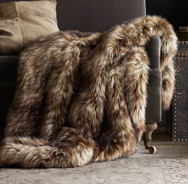 This exotic faux fur throws mimics Siberian red and grey fox. 

Restoration Hardware via AP