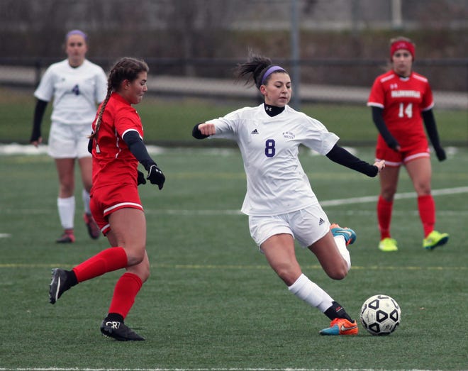 Monroe-Woodbury sophomore midfielder Kaitlyn Hogan (8) looks to pass the ball upfield during Saturday's state Class AA semifinal against Baldwinsville at Tompkins-Cortland Community College. William Montgomery/Times Herald-Record