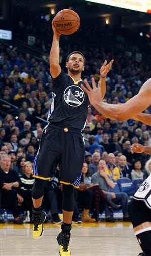 Golden State Warriors' Stephen Curry shoots against the Brooklyn Nets during the first half of an NBA basketball game, Saturday, Nov. 14, 2015, in Oakland, Calif. (AP Photo/George Nikitin)