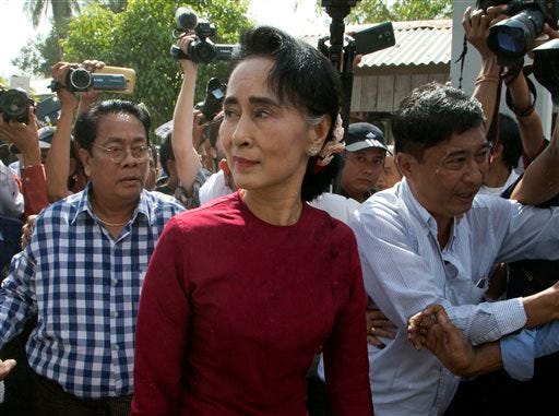 FILE - In this Sunday, Nov. 8, 2015, file photo, leader of Myanmar's National League for Democracy party, Aung San Suu Kyi visits a polling station on the outskirts Yangon, Myanmar. Winning Myanmar's election turned out to be easier than expected for Aung San Suu Kyi and her opposition party, but steering the country will be a test of how the Nobel Peace laureate balances her moral vision with political realities.(AP Photo/Mark Baker, File)
