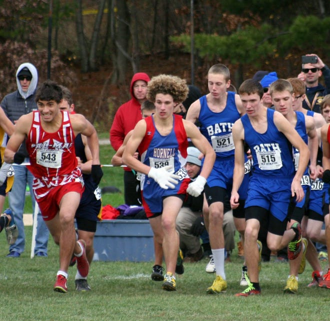 Hornell's Austin Miller, center, races several Bath runners at the start of the Class C race, where he finished 39th (17:39.8) in the state Saturday. Shawn Vargo/Corning Leader
