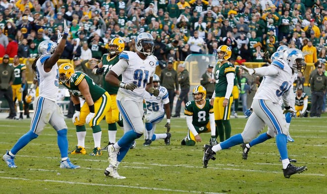 Detroit Lions players celebrate after Green Bay Packers kicker Mason Crosby missed a field goal in the final seconds of the second half of an NFL football game Sunday, Nov. 15, 2015, in Green Bay, Wis. The Lions won 18-16.