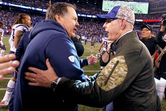 Bill Belichick and Tom Coughlin shake hands at the conclusion of Sunday night's game.