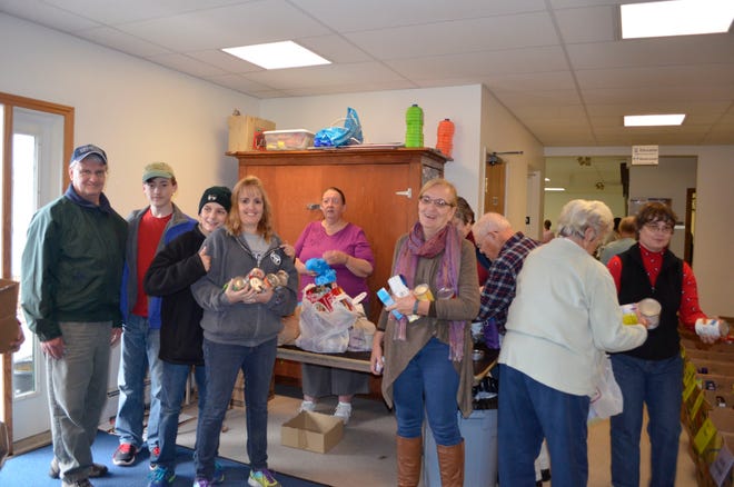 The Boy Scouts and Girl Scouts in Somersworth collected 2,610 pounds of food to help restock the shelves of the Community 
Food Pantry. Courtesy photo