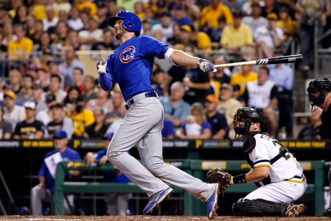 FILE - In this Sept. 16, 2015, file photo, Chicago Cubs' Kris Bryant drives in a run with a double off Pittsburgh Pirates starting pitcher A.J. Burnett in the sixth inning of a baseball game in Pittsburgh. Bryant was selected as the NL Rookie of the Year on Monday, Nov. 16, 2015. (AP Photo/Gene J. Puskar, File)