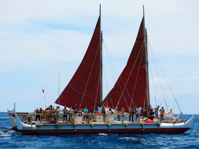 FILE - In this April 29, 2014 file photo, the Hokulea sailing canoe is seen off Honolulu. The Polynesian voyaging canoe, guided solely by nature on a three-year circumnavigation of the globe has reached its halfway point. After arriving in Cape Town, South Africa on Thursday, Nov. 12, 2015, Hokulea's crew is spending a week teaching the local community about traditional navigation, Hawaiian culture and ways to care for the ocean. (AP Photo/Sam Eifling, File)