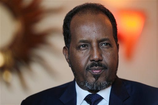 Somali President Hassan Sheikh Mohamud , talks to the Associated Press while visiting Dubai in the United Arab Emirates for a conference on African business opportunities in Dubai, United Arab Emirates, Tuesday, Nov. 17, 2015. Somalia"™s president said Tuesday that al-Qaida and the Islamic State group are merely the same "œevil force" that the world needs to confront in the wake of the attacks on Paris. (AP Photo/Kamran Jebreili)