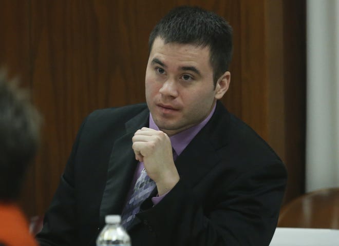 Daniel Holtzclaw listens to testimony as prosecutors continue their case in the second week of his trial in Oklahoma City, Thursday, Nov. 12, 2015. Holtzclaw, a former Oklahoma City police officer, is facing dozens of charges alleging he sexually assaulted 13 women while on duty. (AP Photo/Sue Ogrocki)