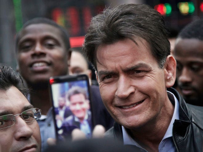 Actor Charlie Sheen, shown in this file photo, said Tuesday he has tested positive for the virus that causes AIDS.